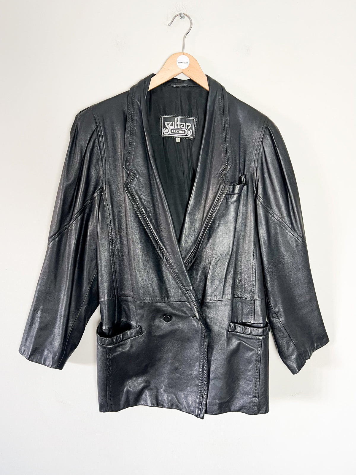Veste blazer oversize vintage années 80 en cuir noir à épaulettes (T38)