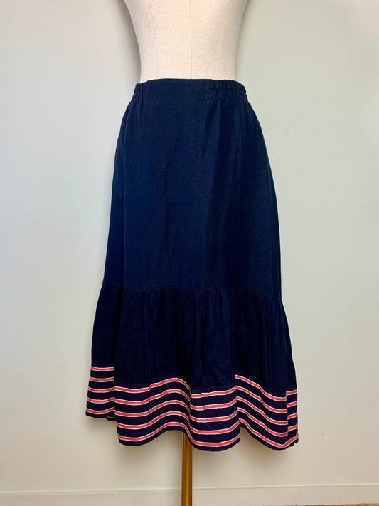Jupe mi-longue asymétrique marine avec bandes rouge en mélange lin