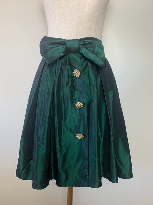 Jupe patineuse à plis verte mordoré avec nœud et boutons dorés vintage